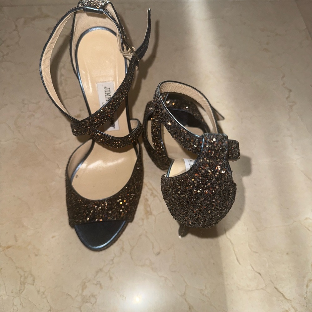 Jimmy Choo Black and Gold Heels with High Stiletto and Open Toe Design
